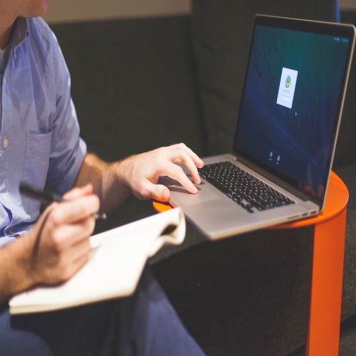 MAN LAPTOP WRITING